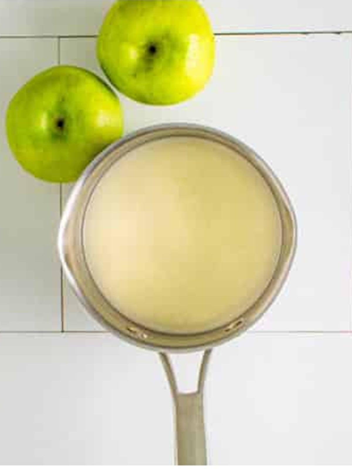 Sweet glaze made in a saucepan for apple fritters.