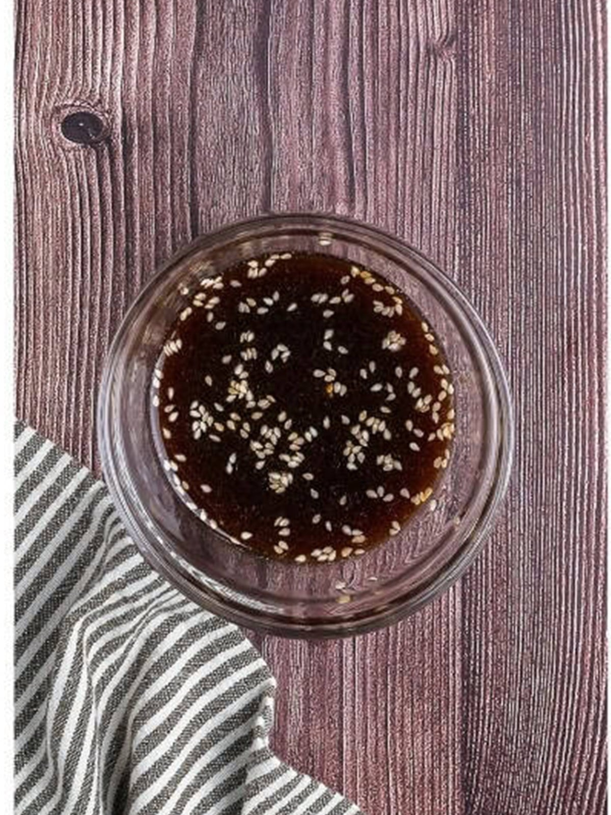 Sticky soy and gochujang glaze for Asian meatballs in a small bowl.