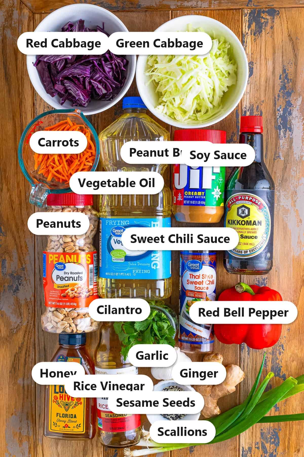 Labeled ingredients to make Asian slaw with sweet and savory dressing.