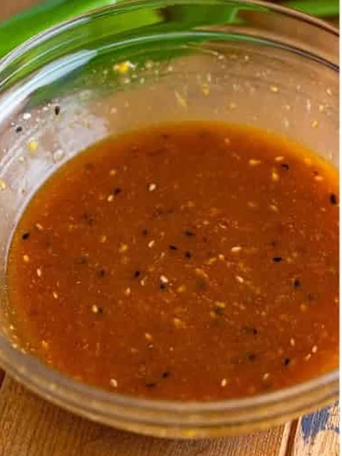 The sweet and savory Asian dressing whisked smooth in a bowl.