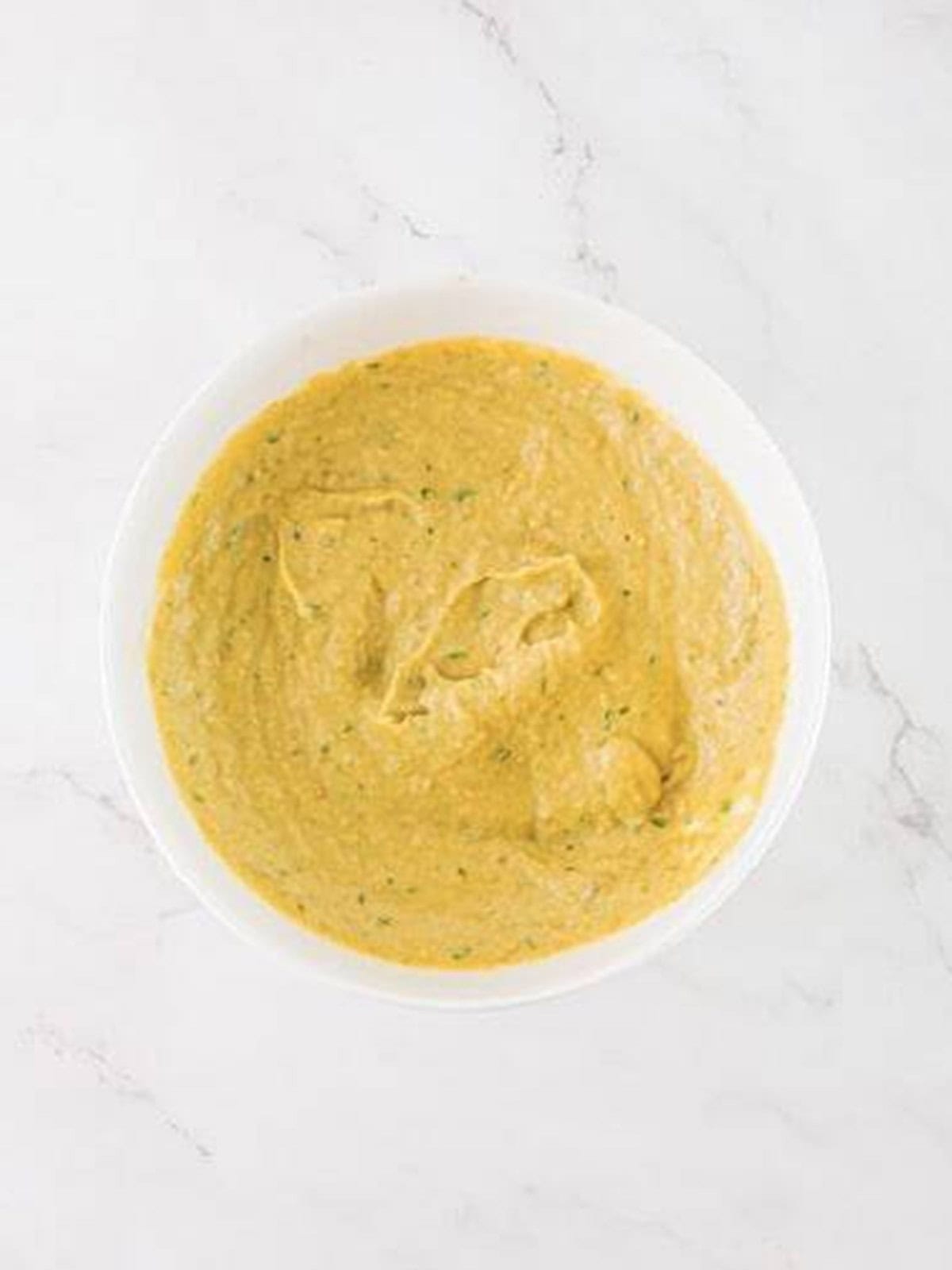 Smooth, creamy baba ganoush blended in a bowl ready to serve.