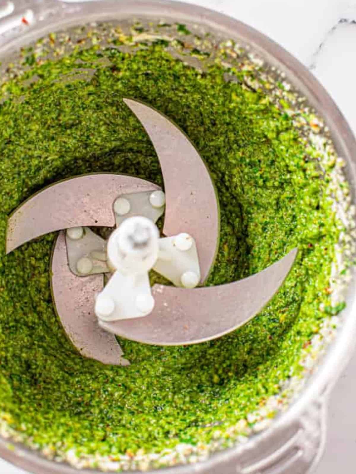 Fresh basil pesto with Parmesan and pecans blended in a food processor for bacon pesto pasta.