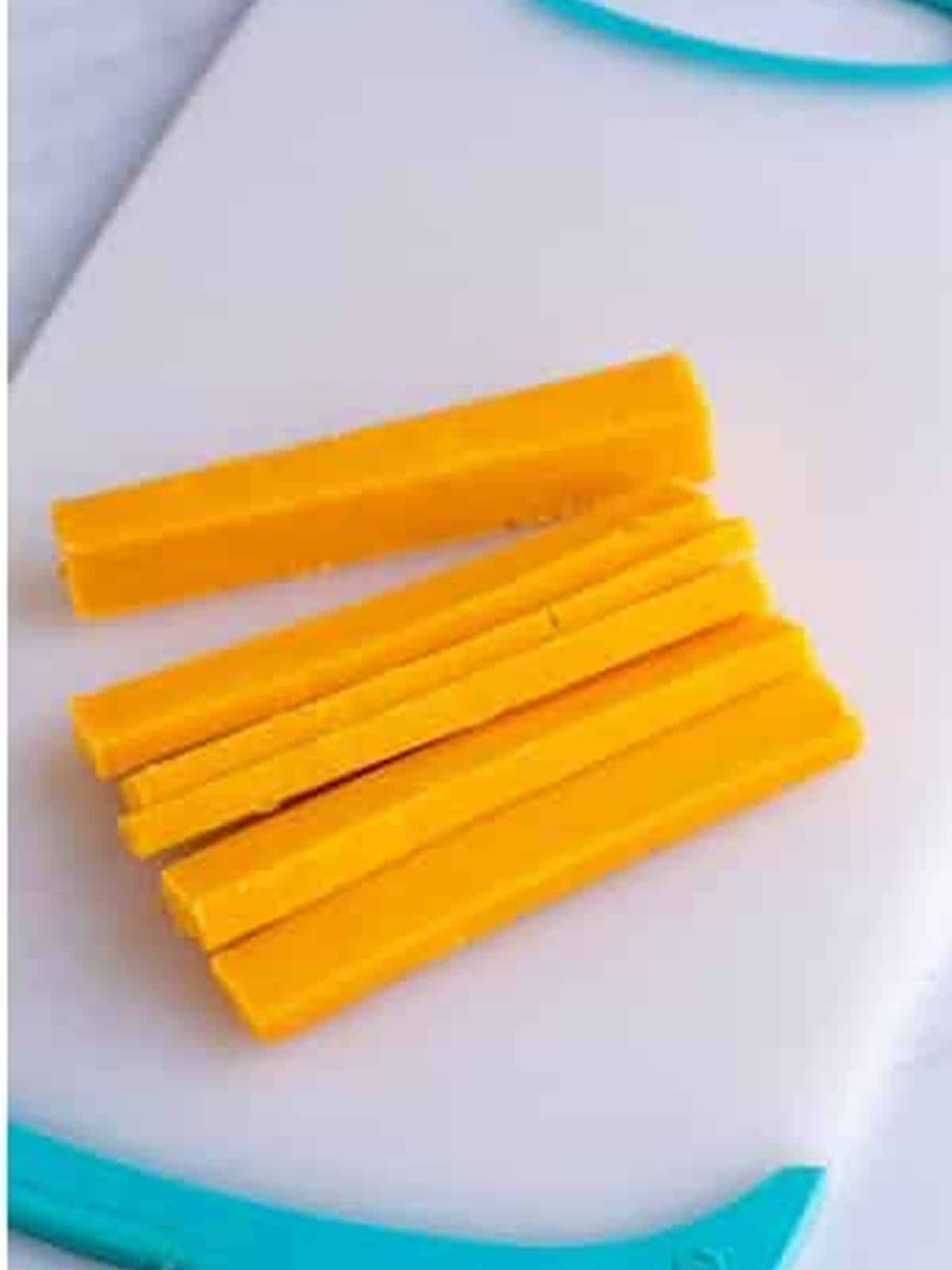Extra sharp cheddar cheese cut into strips.