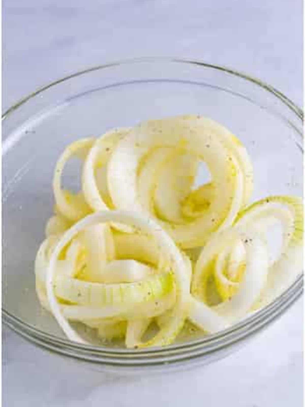 Sliced sweet onions tossed with olive oil, salt, and pepper.