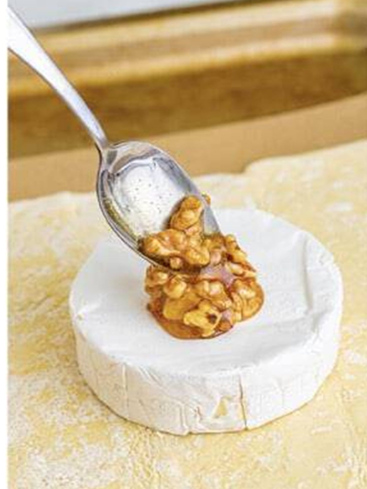 Honey walnut mixture spooned over a wheel of brie on puff pastry.