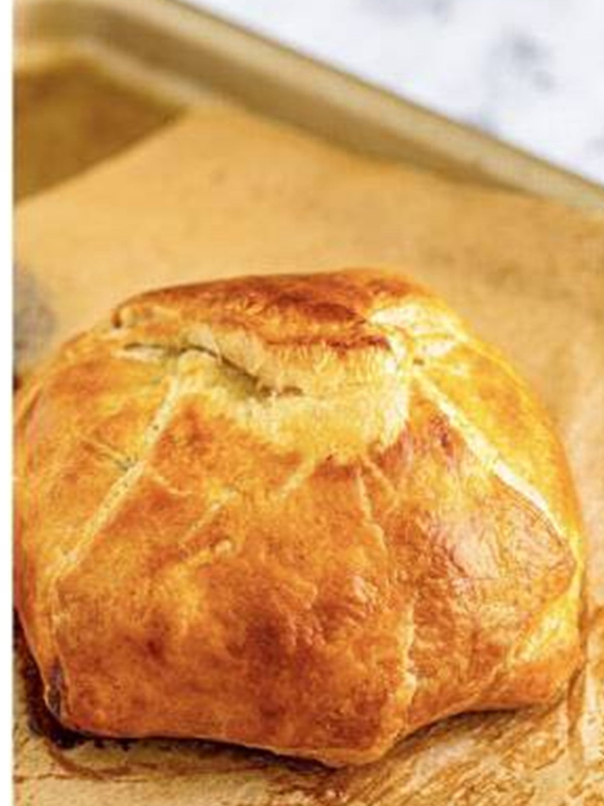 Golden baked brie in puff pastry fresh from the oven.