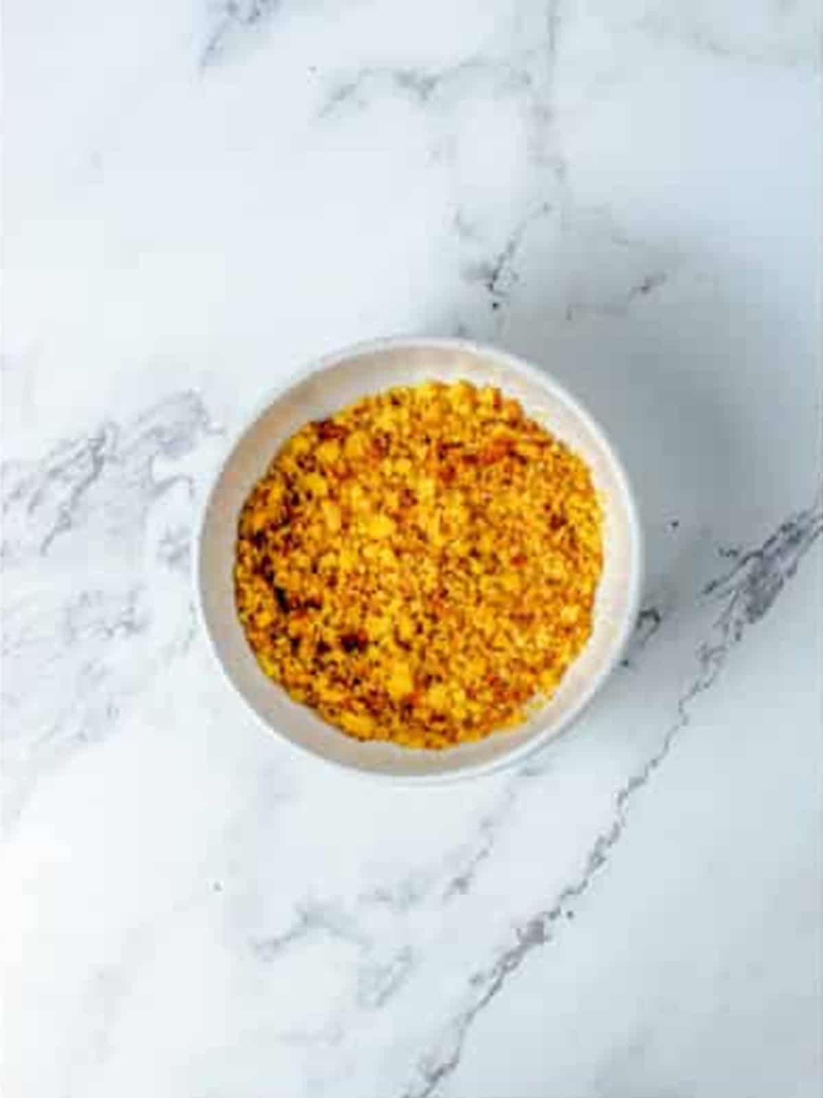 Buttered cornbread crumbs ready to scatter over the Baked Mac and Cheese.