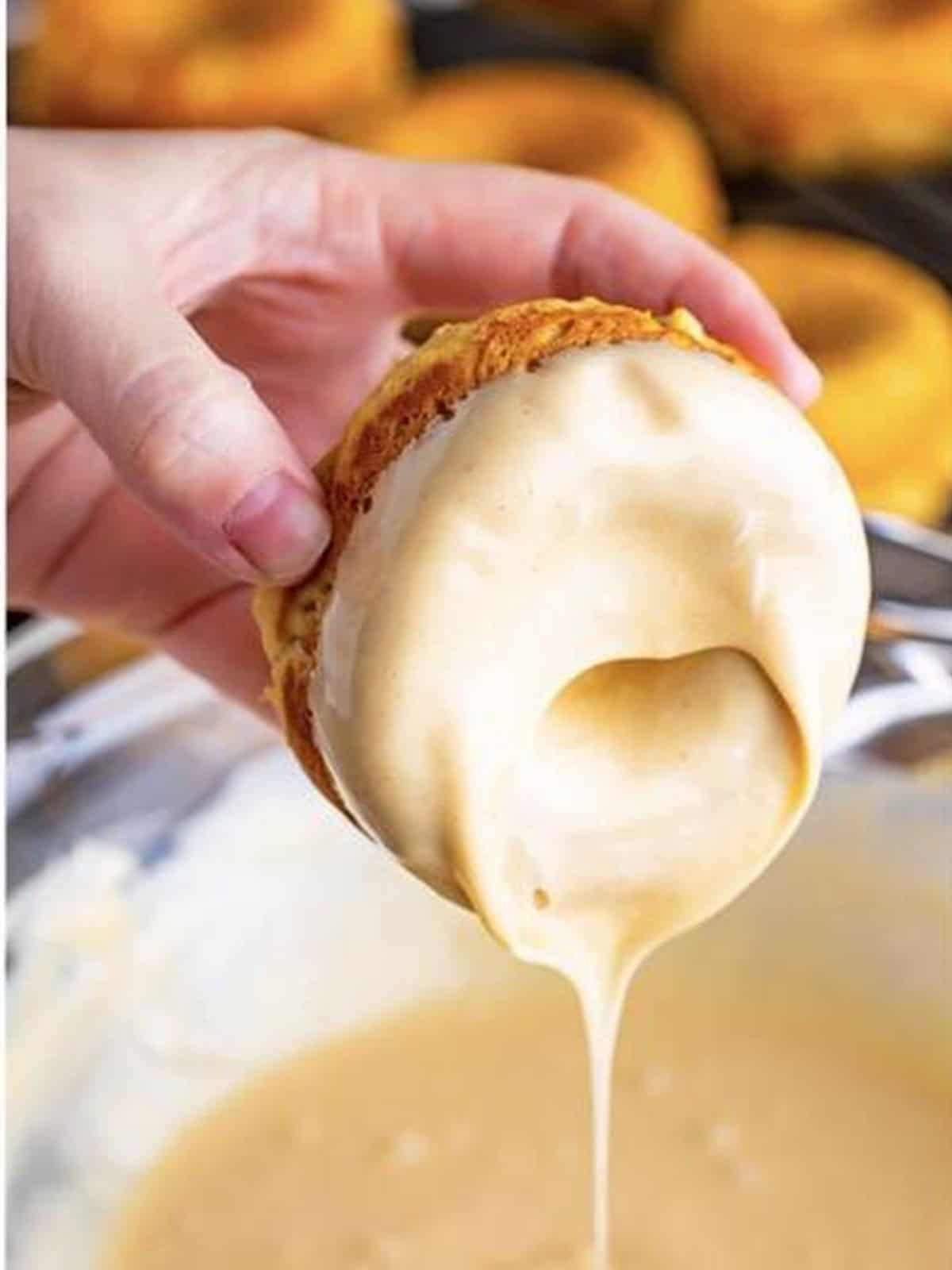 A baked peanut butter donut dipped into the peanut butter glaze.