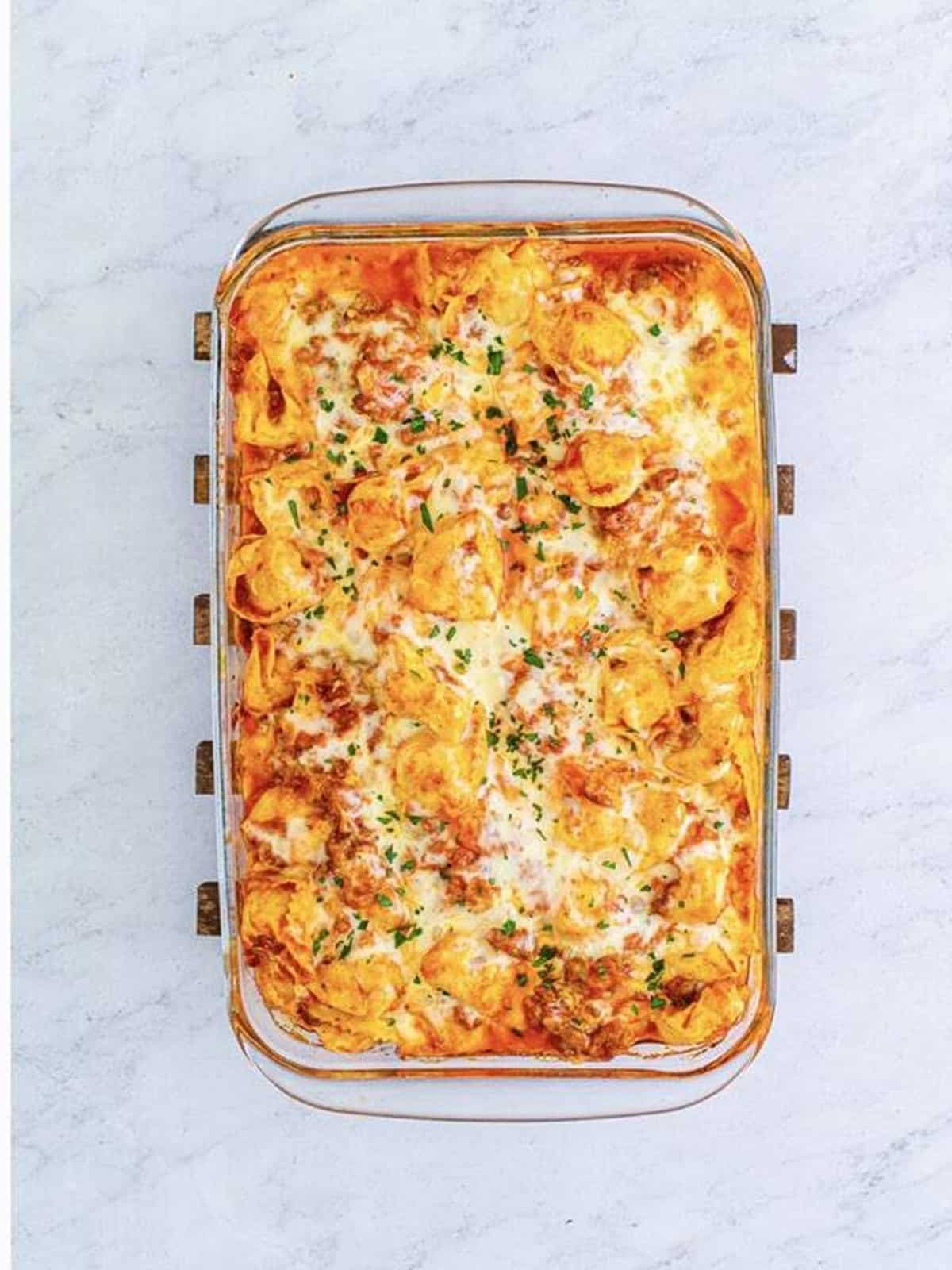 Golden bubbly baked tortellini with melted cheese fresh from the oven.