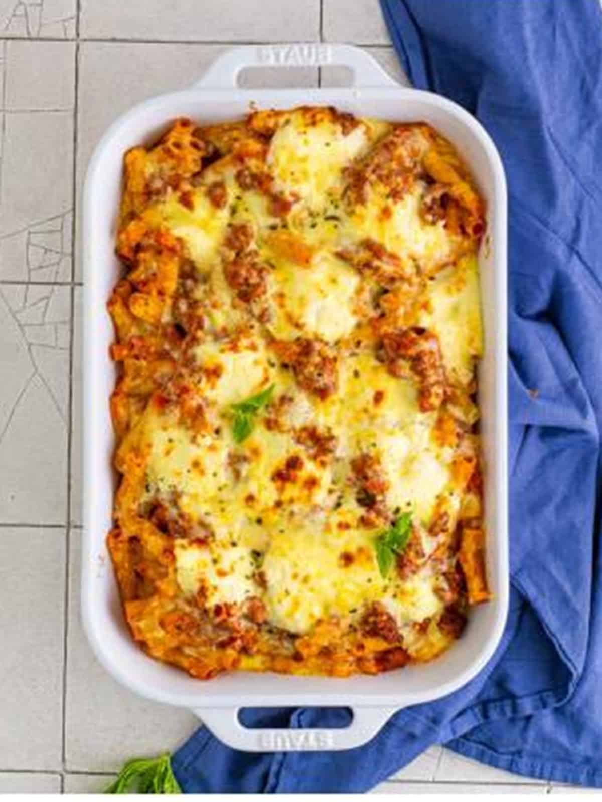 Golden bubbly baked ziti fresh from the oven in a baking dish