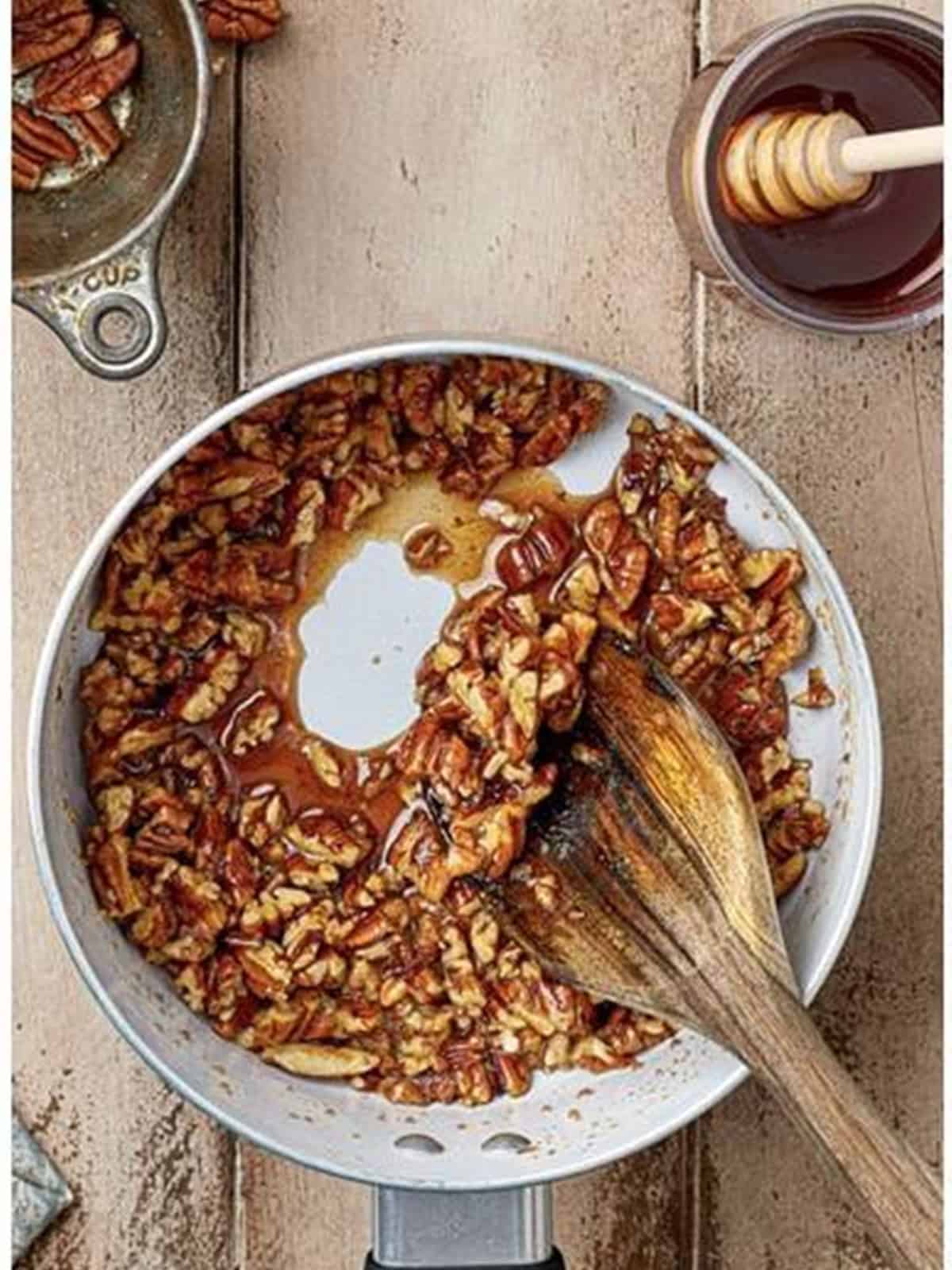 Simmering the honey pecan topping for Baklava Bites until thick.