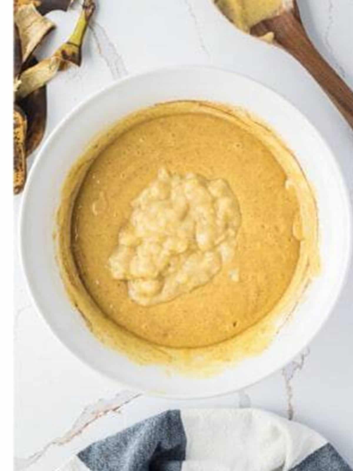 Mashed ripe bananas with baking soda added to the cake batter.