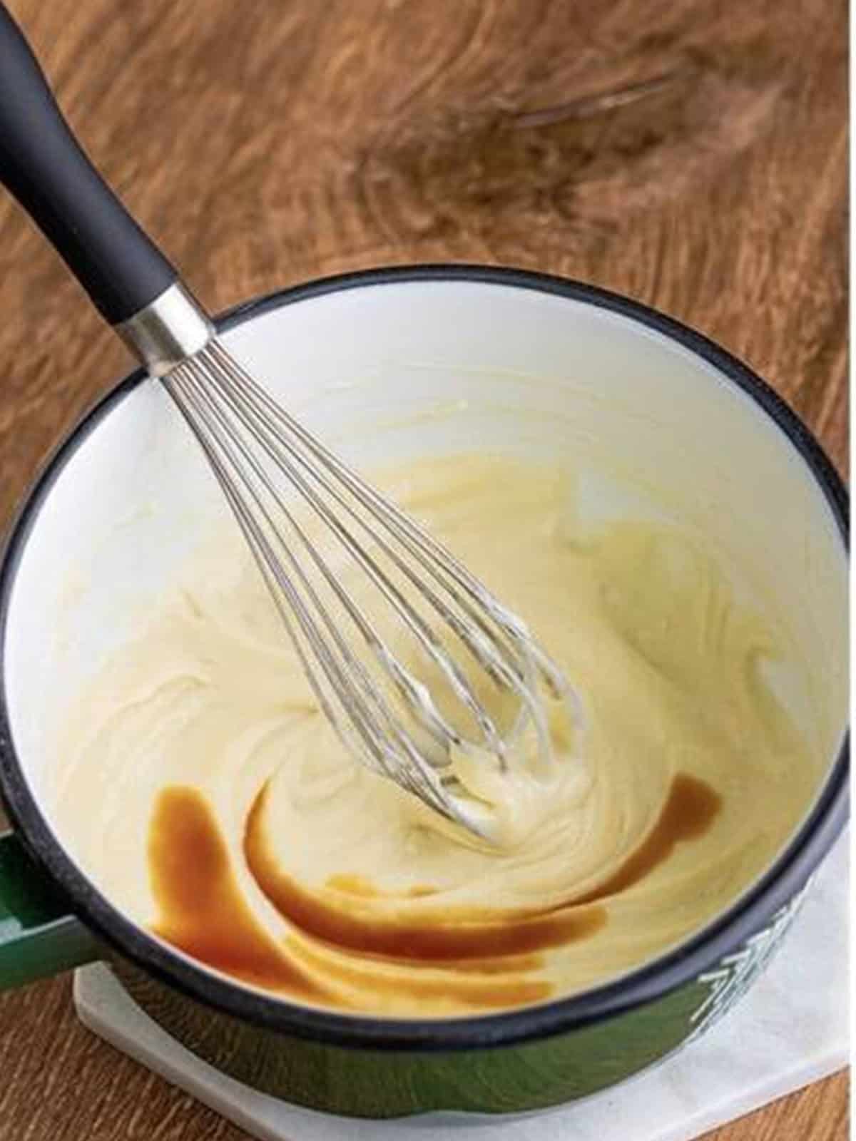 Vanilla whisked into the cooled milk mixture for the frosting.