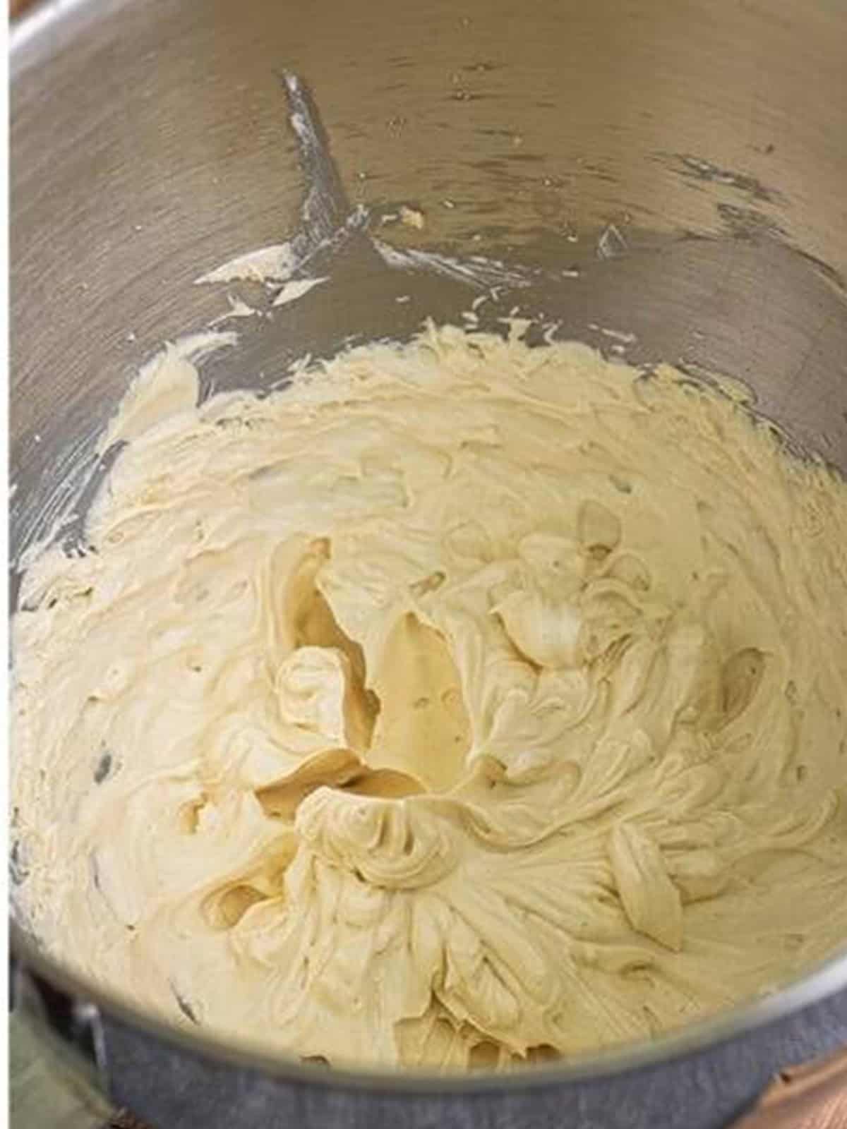 Finished fluffy brown sugar frosting ready to top the banana cupcakes.