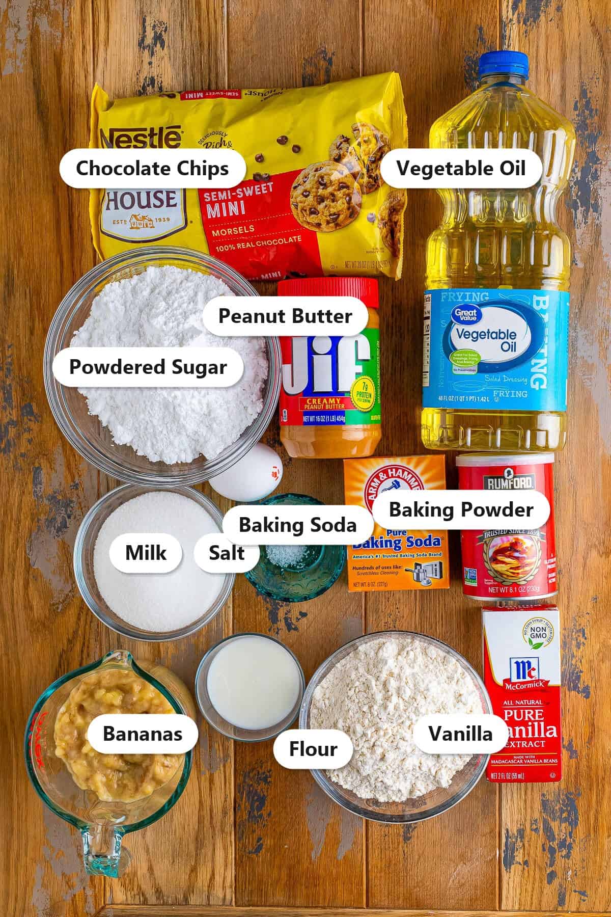 Labeled banana donut ingredients including mashed bananas, flour, peanut butter, oil, and chocolate chips.