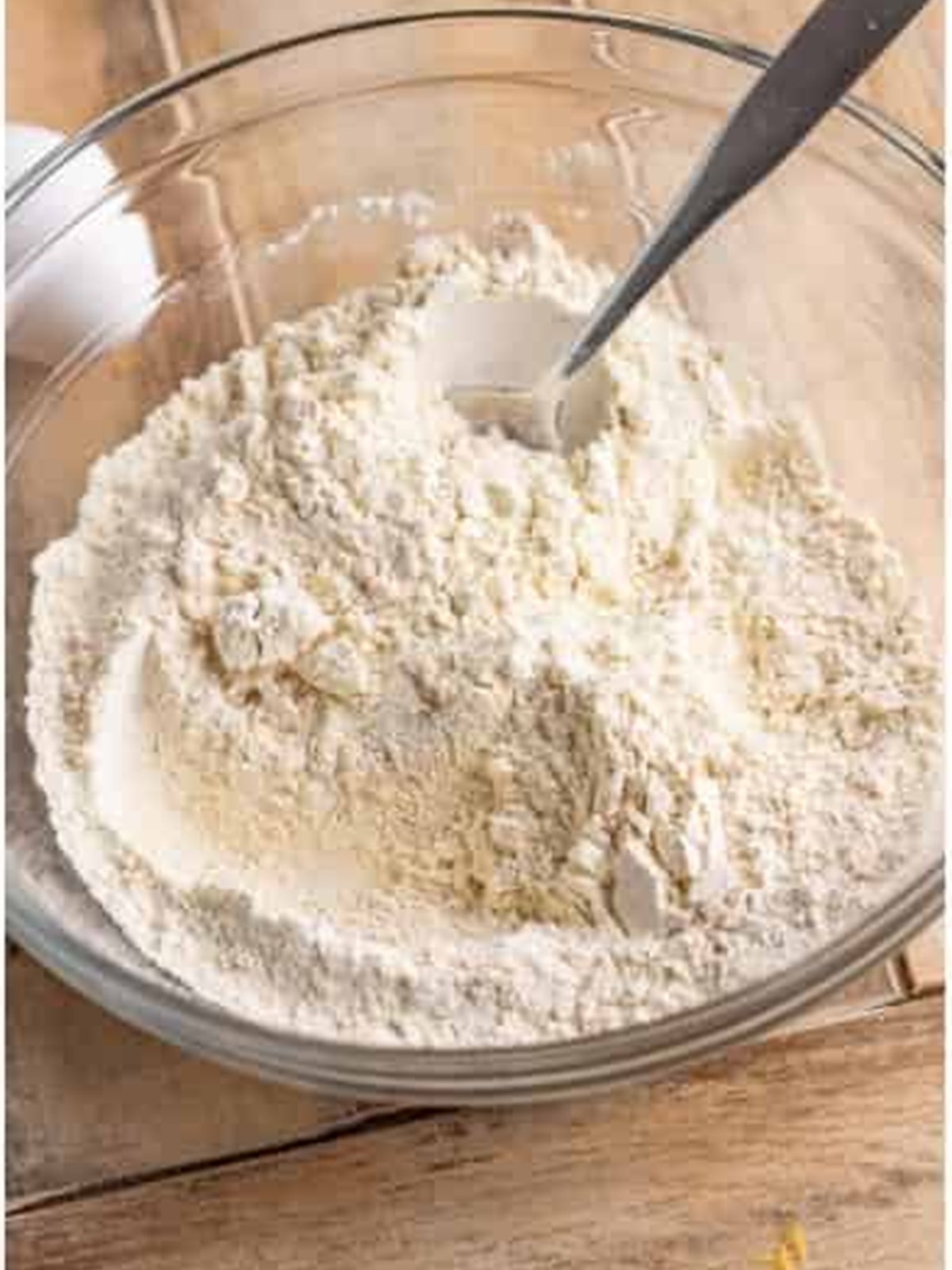 Flour, baking powder, baking soda, cinnamon, and salt whisked together in a bowl.