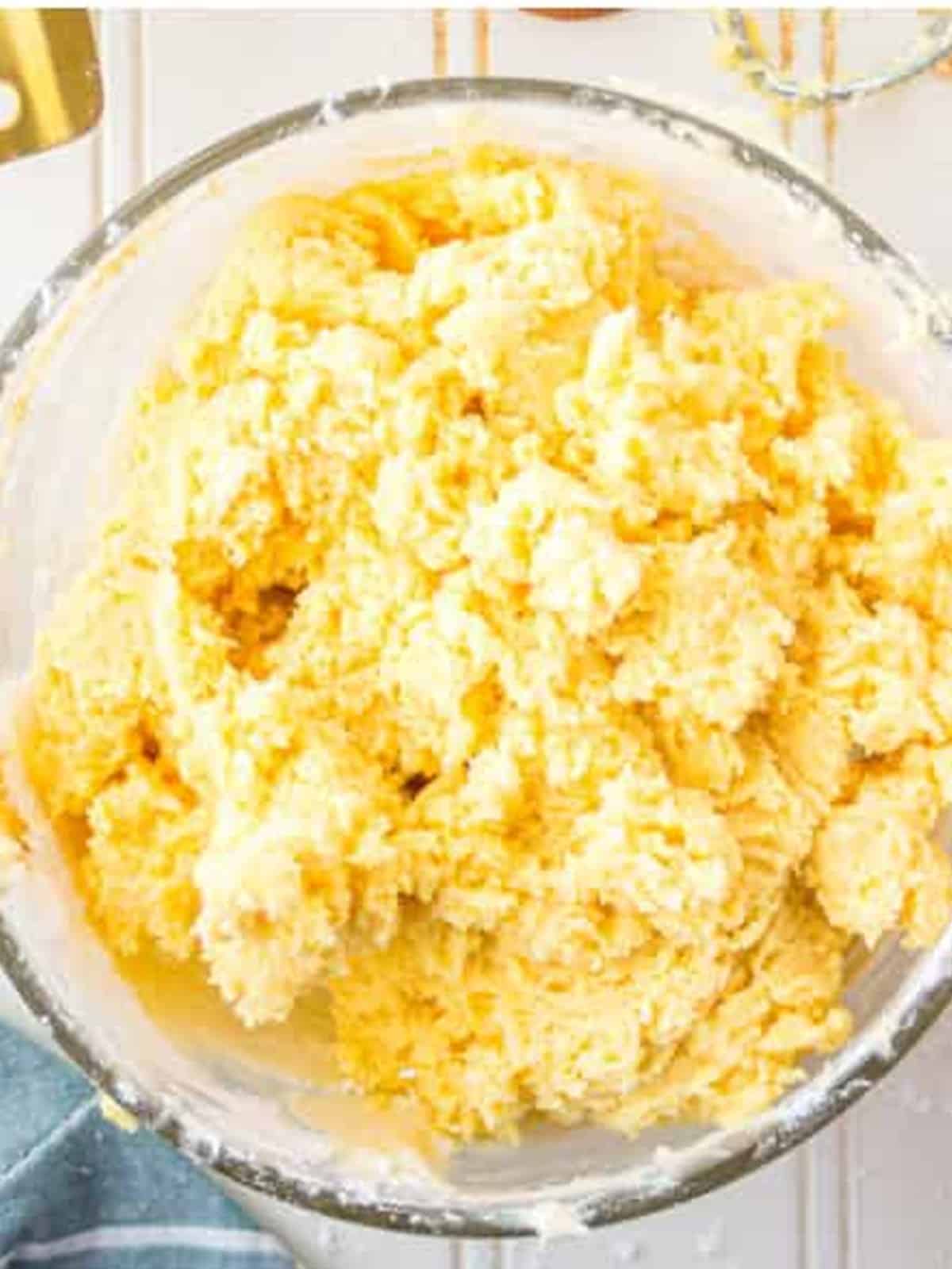Fluffy banana pudding cream cheese mixture whipped in a glass bowl.