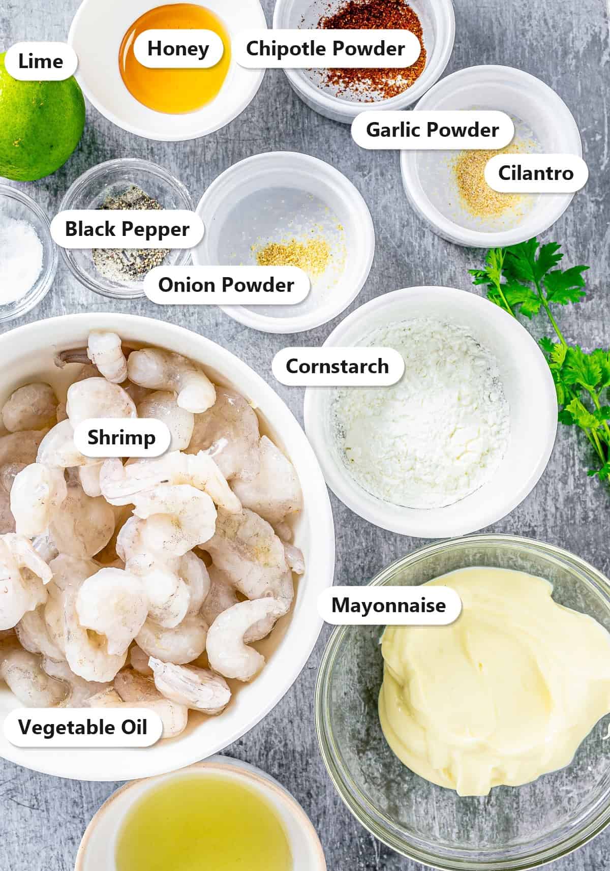 Labeled ingredients for bang bang shrimp including shrimp, mayonnaise, honey, lime, chipotle powder, and cornstarch.