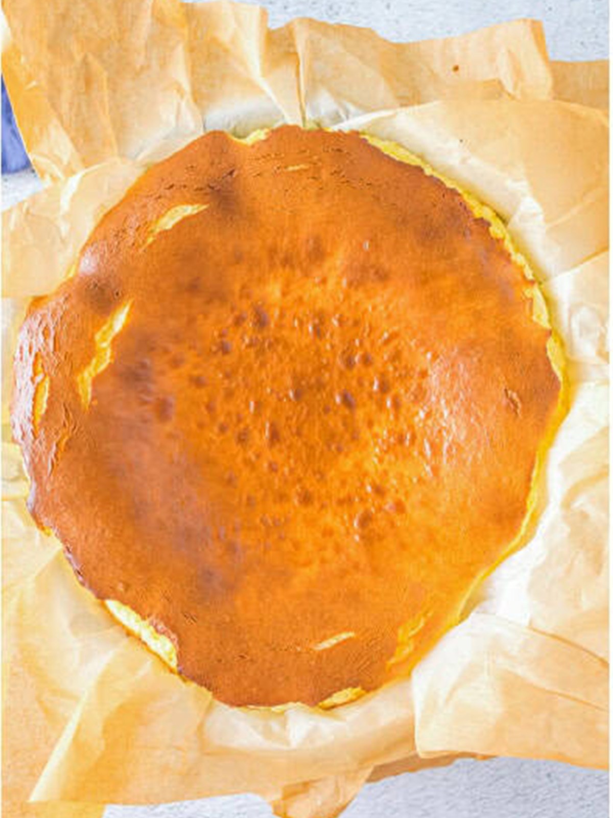 Baked basque cheesecake with a deeply golden, burnished top.