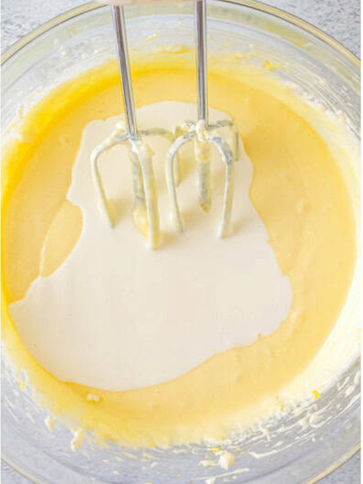 Smooth, silky basque cheesecake batter in a mixing bowl.