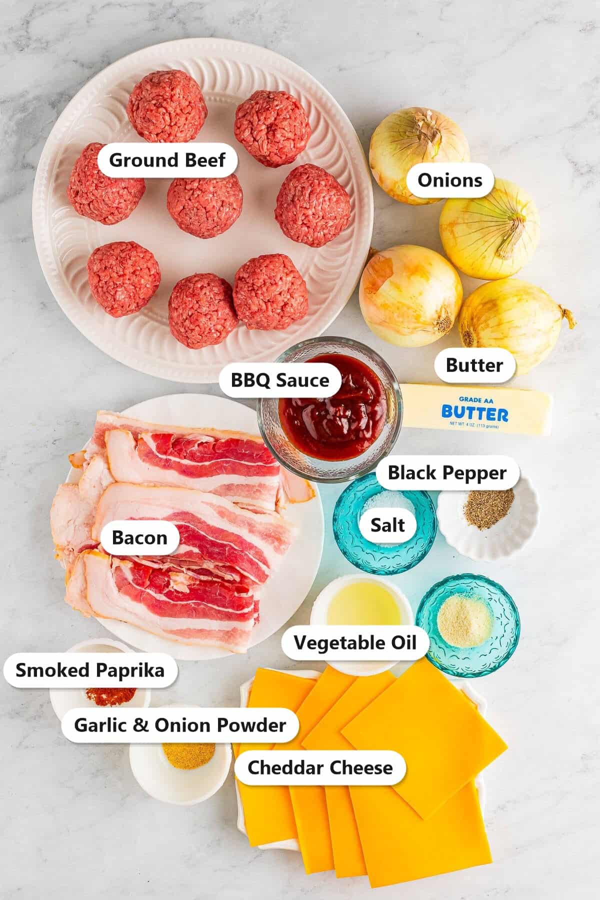 BBQ bacon smash burger ingredients labeled including ground beef, onions, butter, BBQ sauce, bacon, cheddar cheese, salt, black pepper, smoked paprika, garlic and onion powder, and vegetable oil.