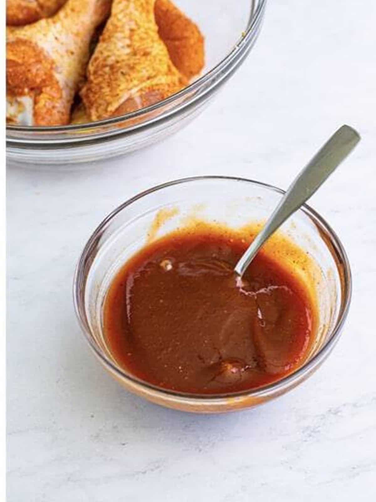 BBQ sauce stirred with water in a small bowl.