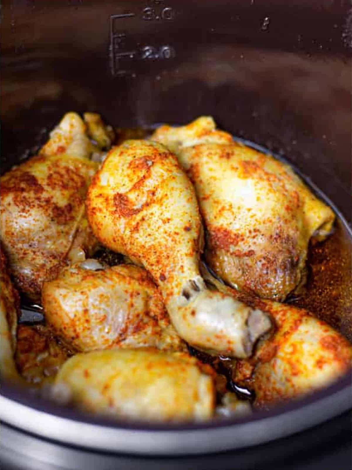 Tender cooked chicken in the slow cooker for BBQ chicken.