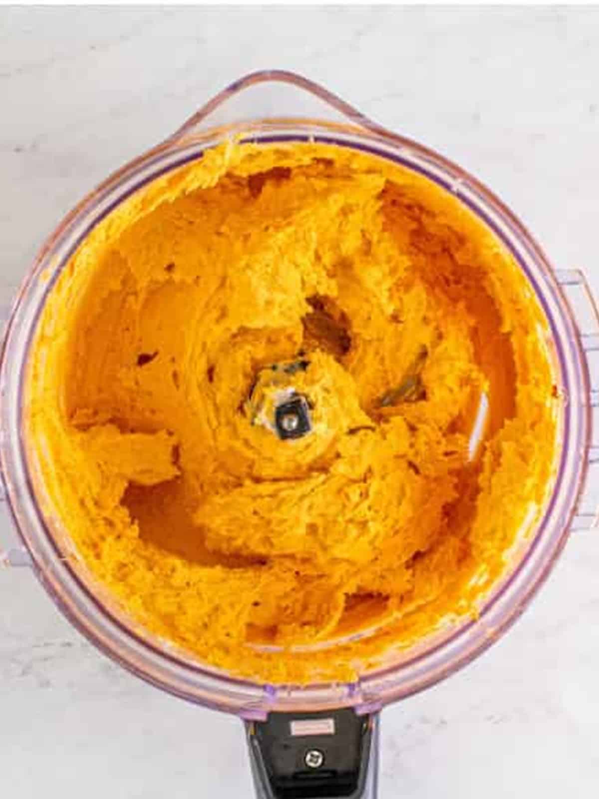 Cheese mixture processed until smooth in the food processor for beer cheese dip.
