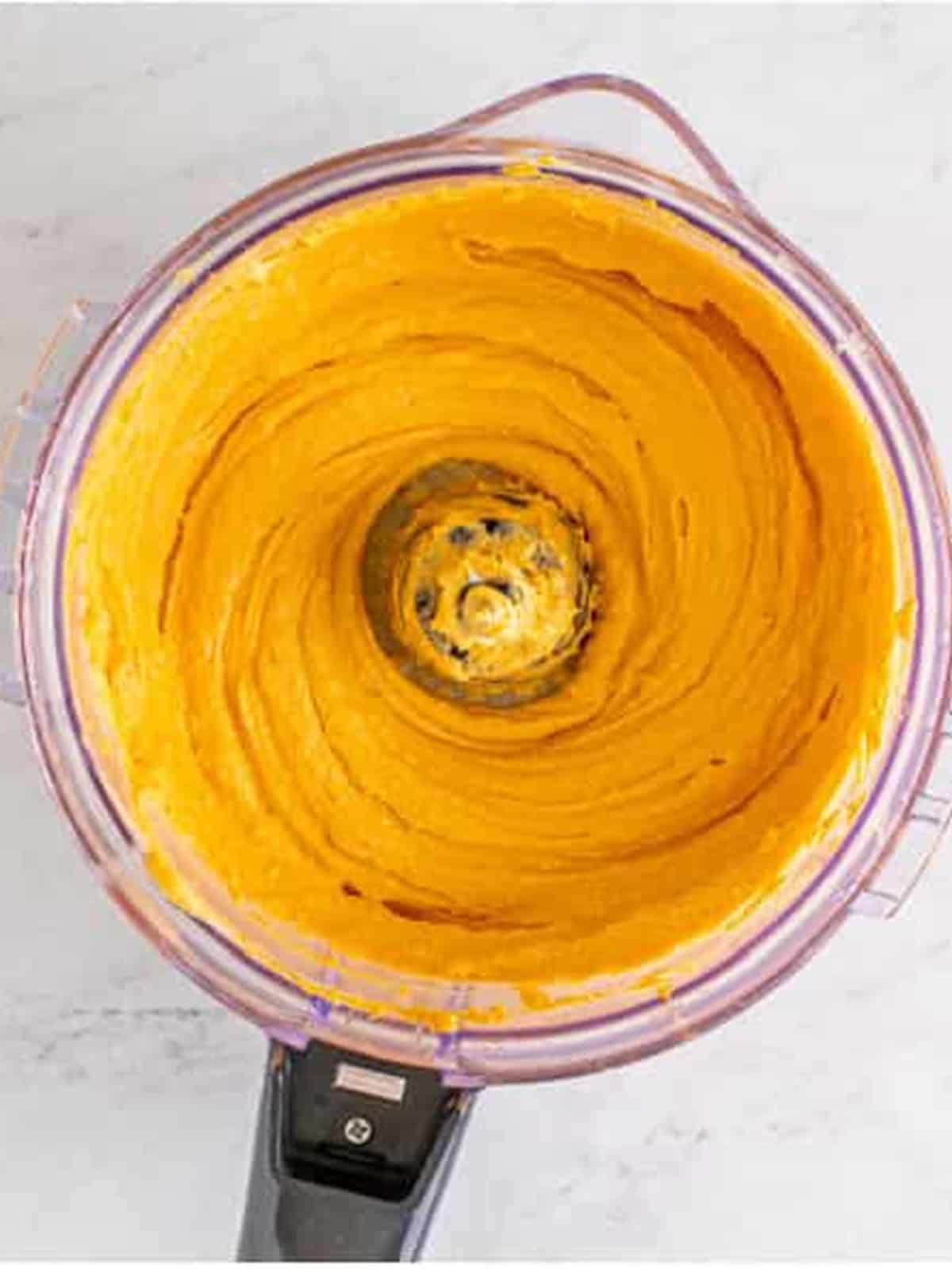 Finished beer cheese dip whipped silky smooth in the food processor before chilling.