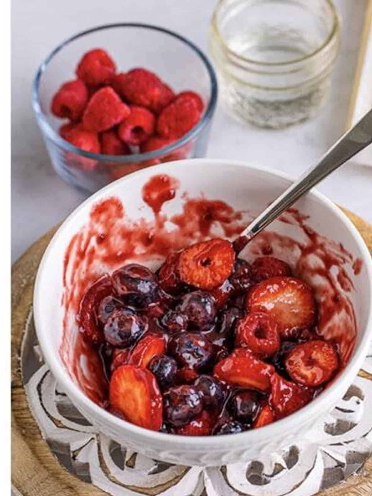 Triple berry preserves mixed with fresh blueberries, raspberries, and strawberries for berry danish.