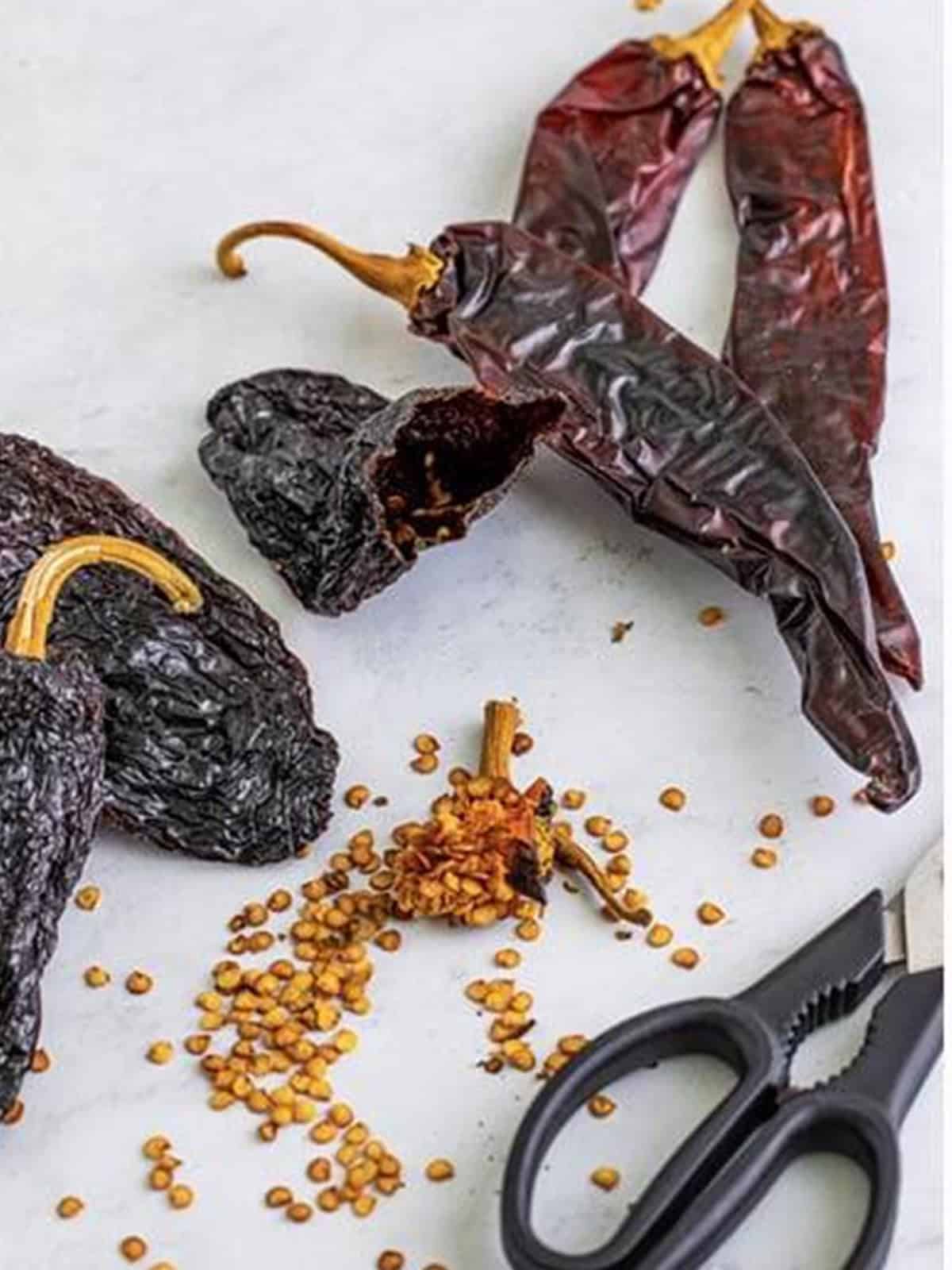 Dried ancho and guajillo chiles trimmed and deseeded for birria tacos.