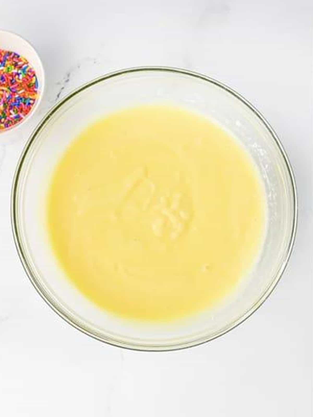 Smooth birthday cake pudding mixture ready for the whipped vodka.