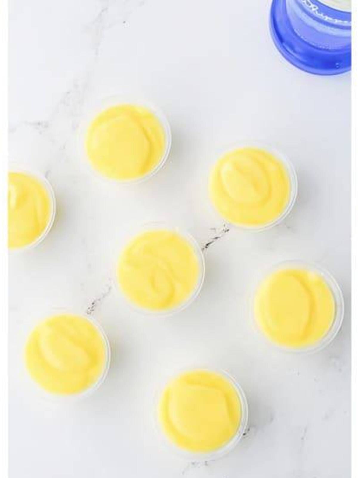 Birthday cake pudding divided into small shot cups to chill.