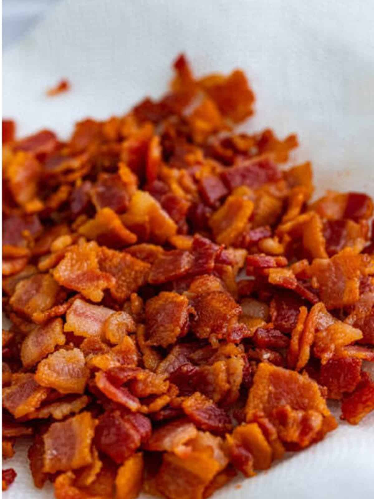 Crispy cooked bacon pieces draining for black eyed peas recipe.