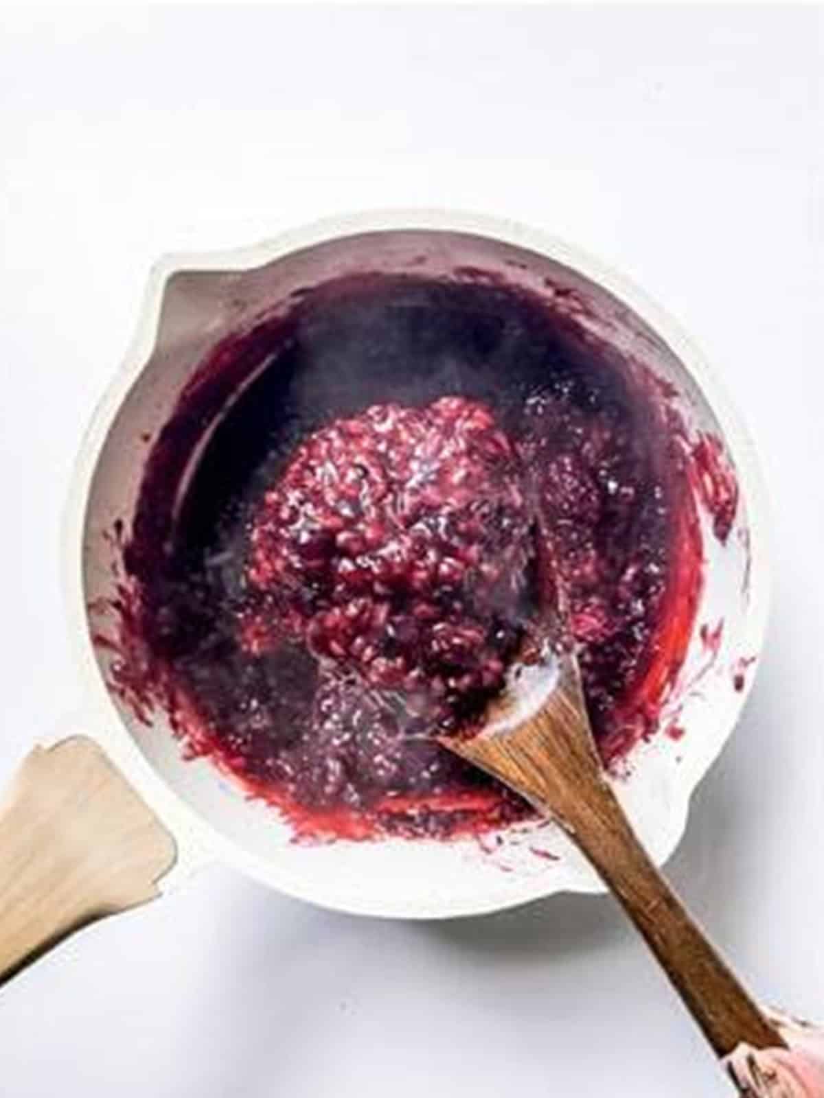 Thickened blackberry filling cooked down in a saucepan.
