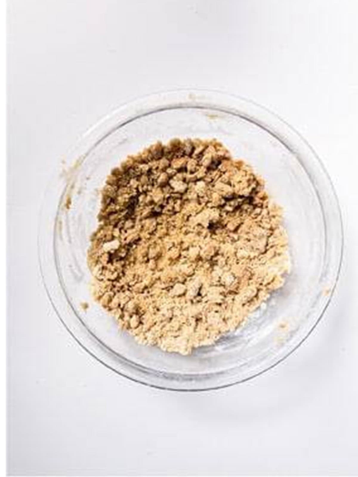 Crumbly crisp topping with brown sugar and granola in a bowl.