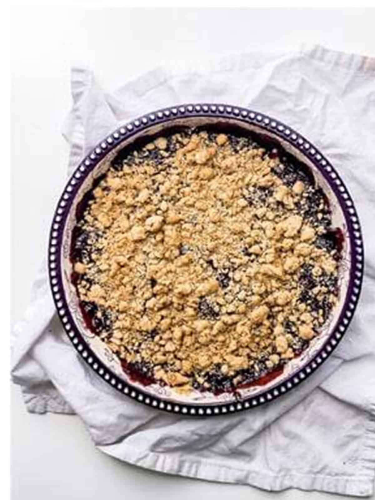 Golden baked blackberry crisp bubbling in a baking dish.