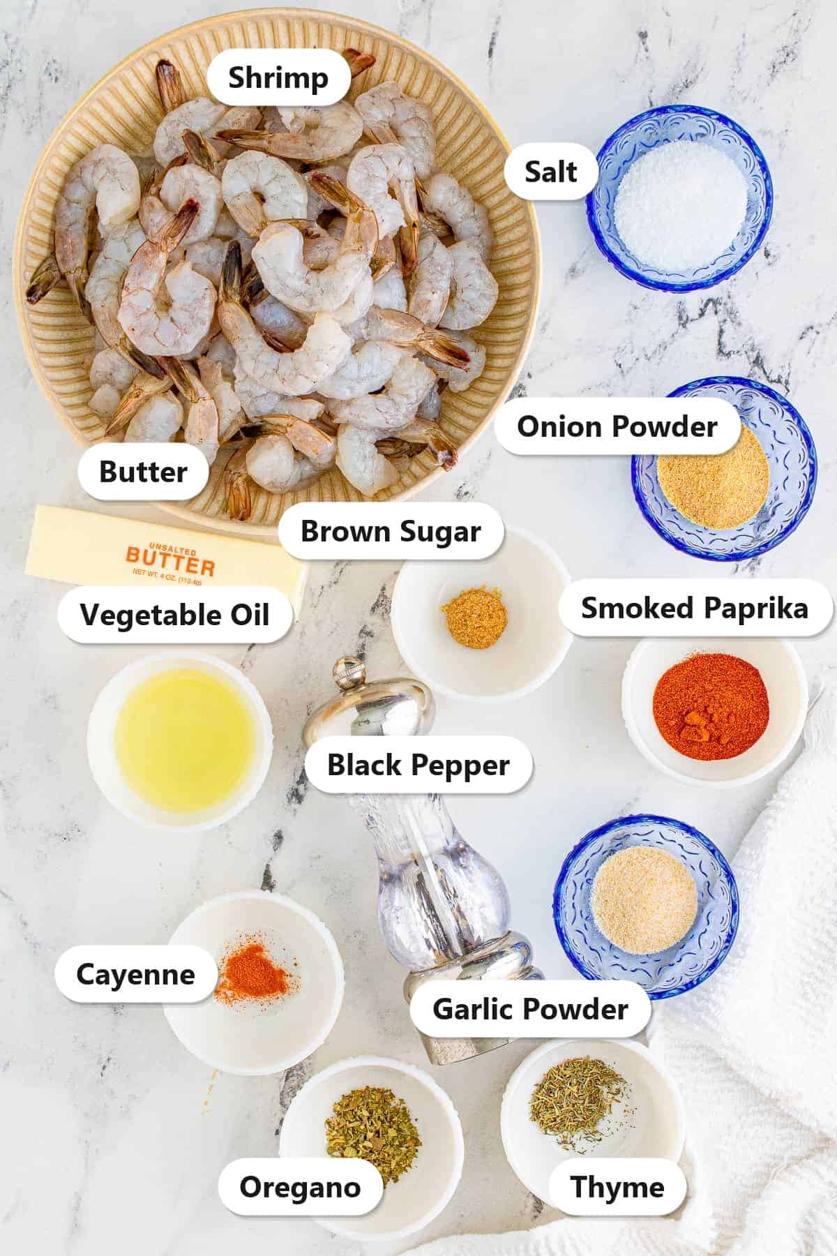 Labeled ingredients for Blackened Shrimp including shrimp, butter, oil, smoked paprika, garlic powder, onion powder, brown sugar, cayenne, oregano, and thyme.