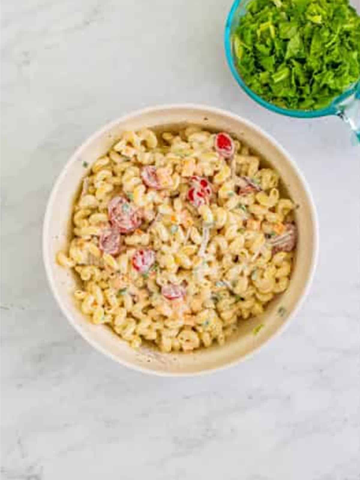 BLT Pasta Salad tossed in ranch dressing ready to chill in the fridge.