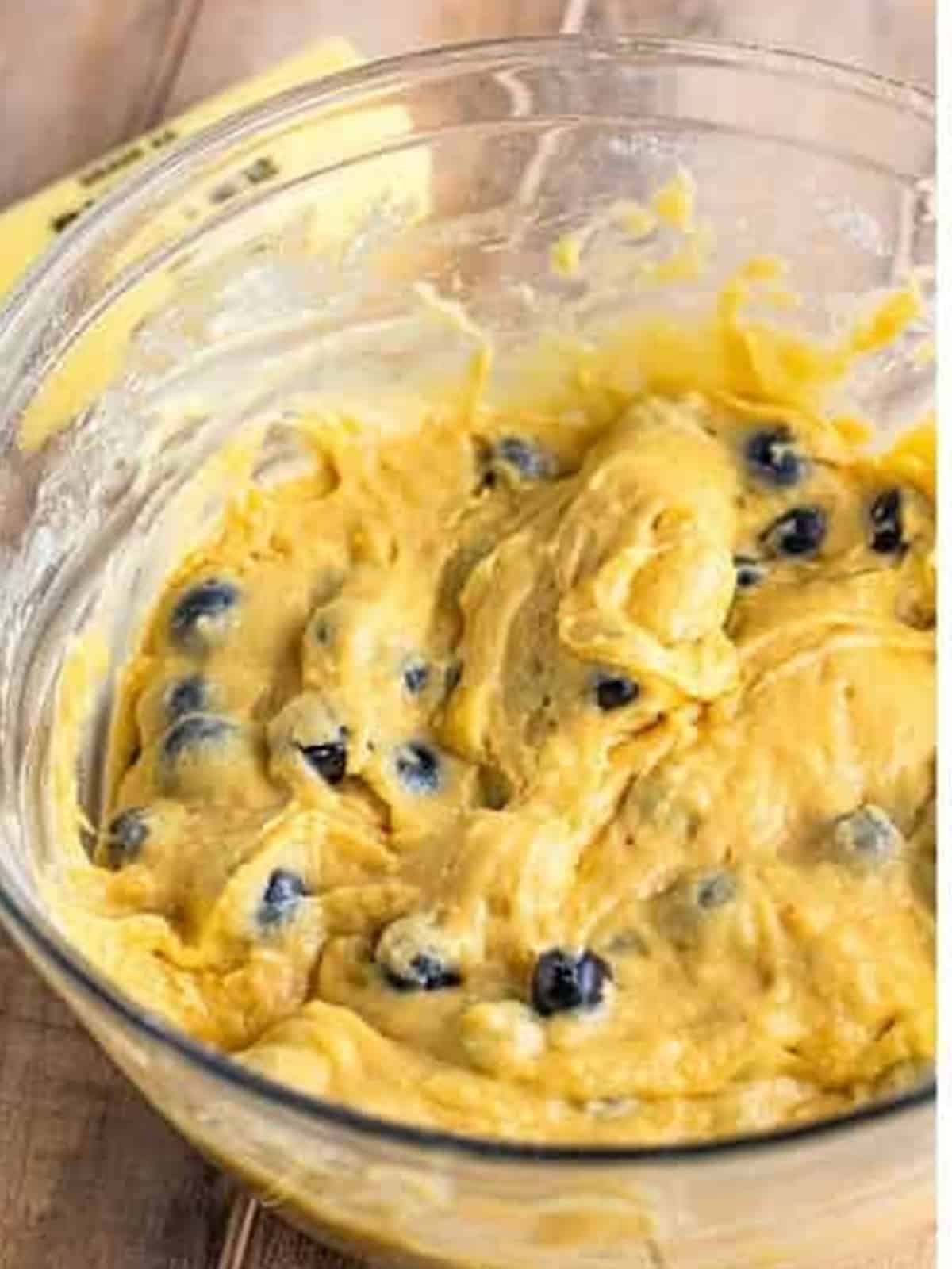 Folding floured fresh blueberries into the Blueberry Cake batter.