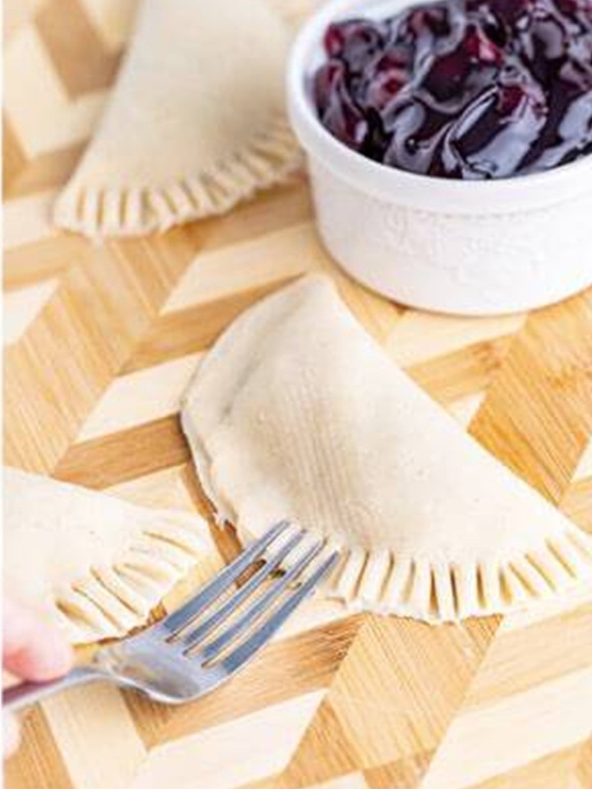 Hand pie folded over and crimped closed with a fork.