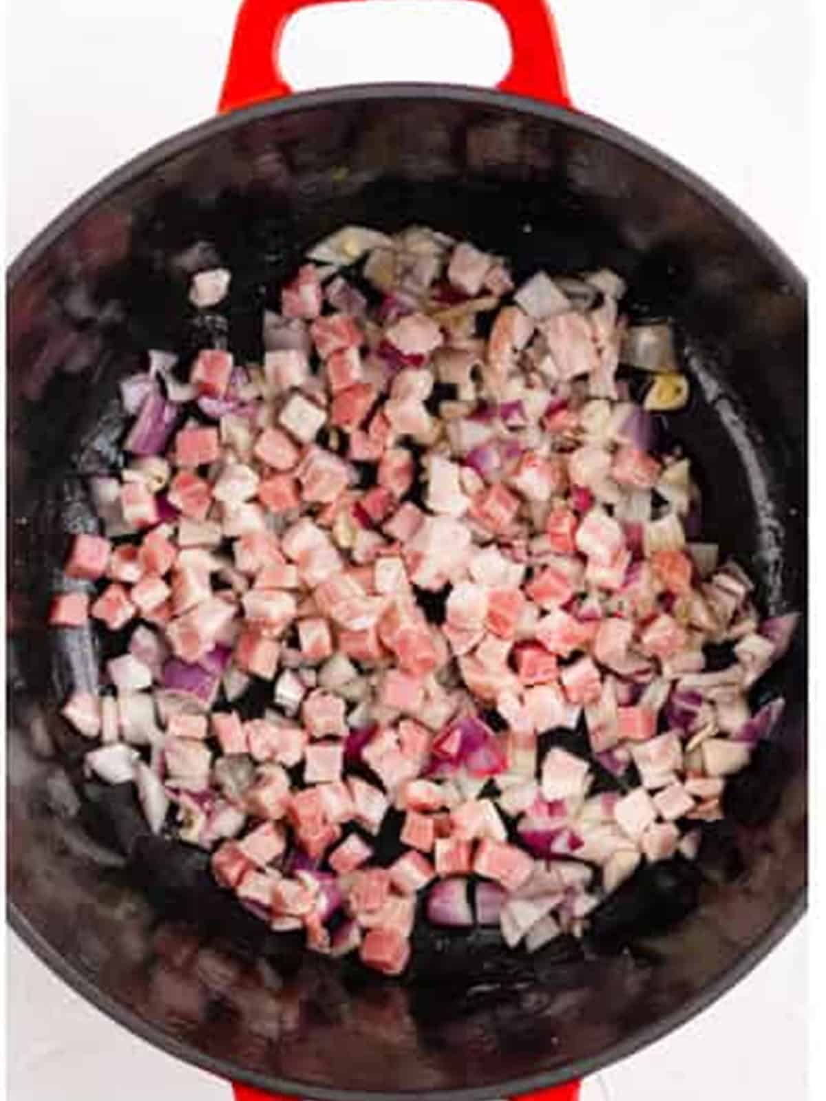 Diced pancetta and onion added to the Dutch oven for braised beef short ribs.