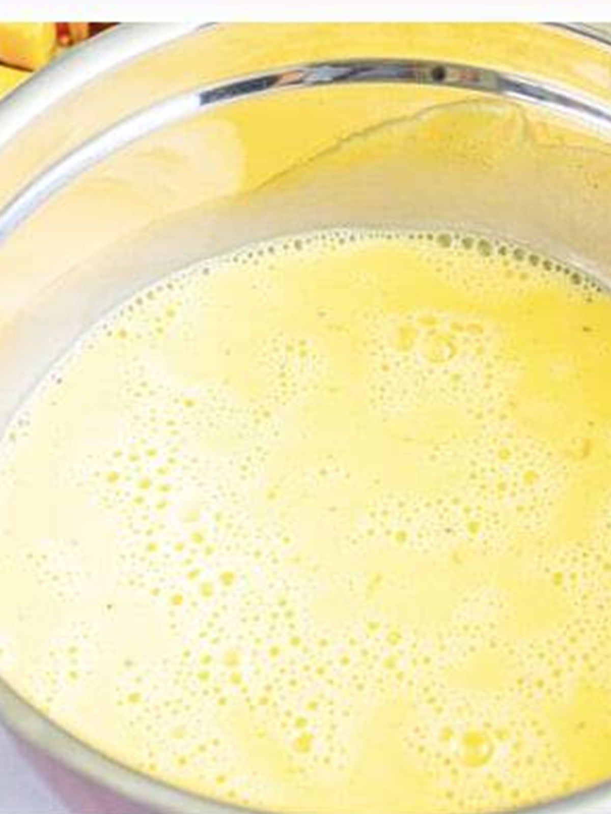 Whisked eggs and half and half for breakfast casserole