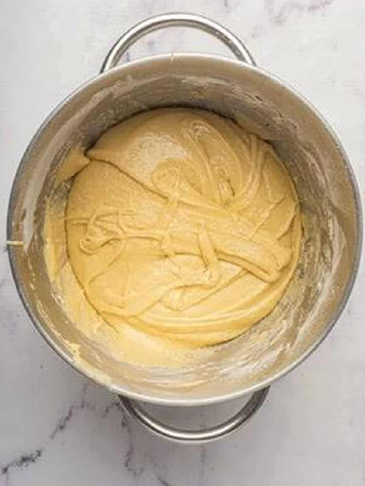 The brioche dough kneaded until silky and elastic in the mixer bowl.