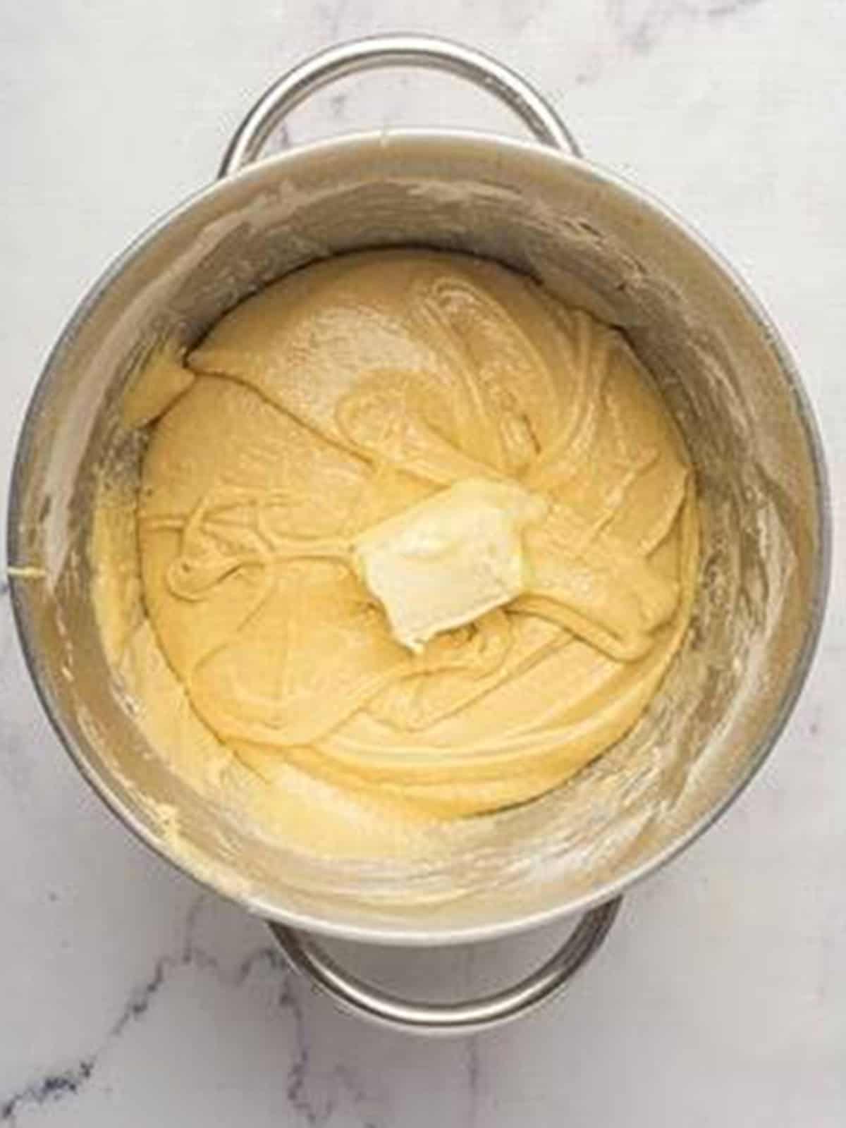 Softened butter added one tablespoon at a time to the brioche dough.