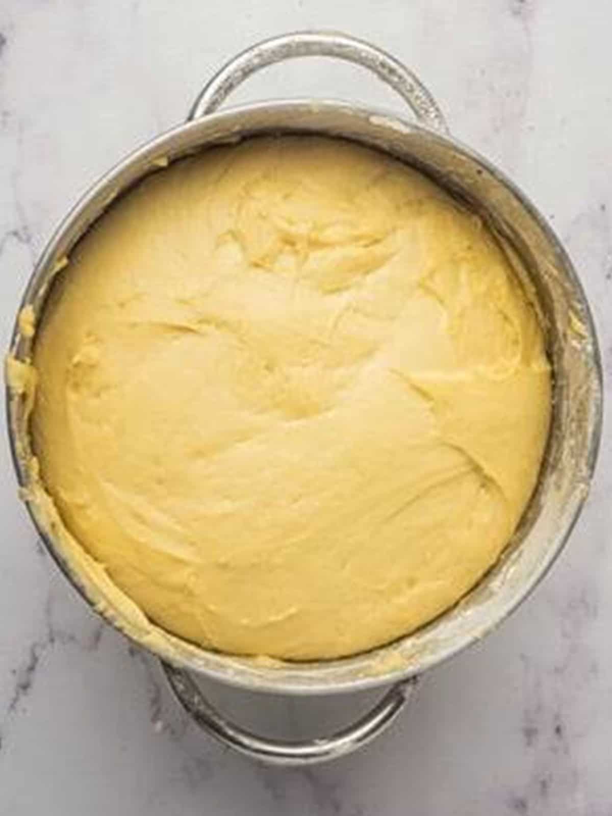 The brioche dough risen until doubled in size in the bowl.