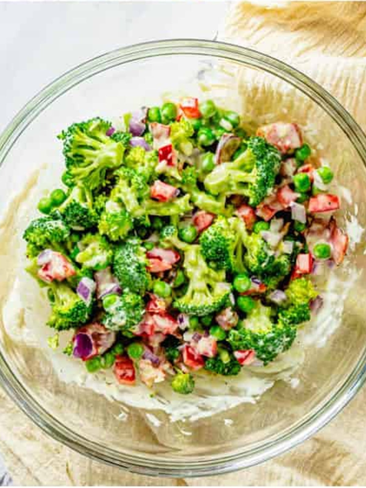 Bacon, broccoli, bell pepper, onion, and peas added to the dressing bowl.