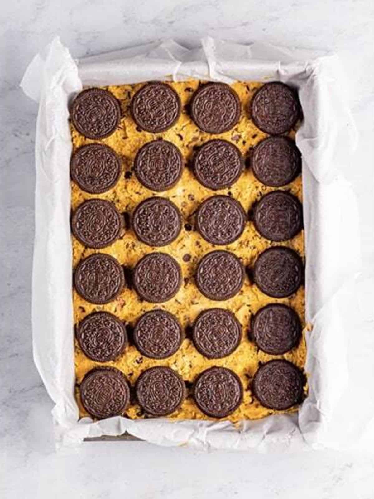 Oreo cookies layered over the cookie dough base for Brookies.