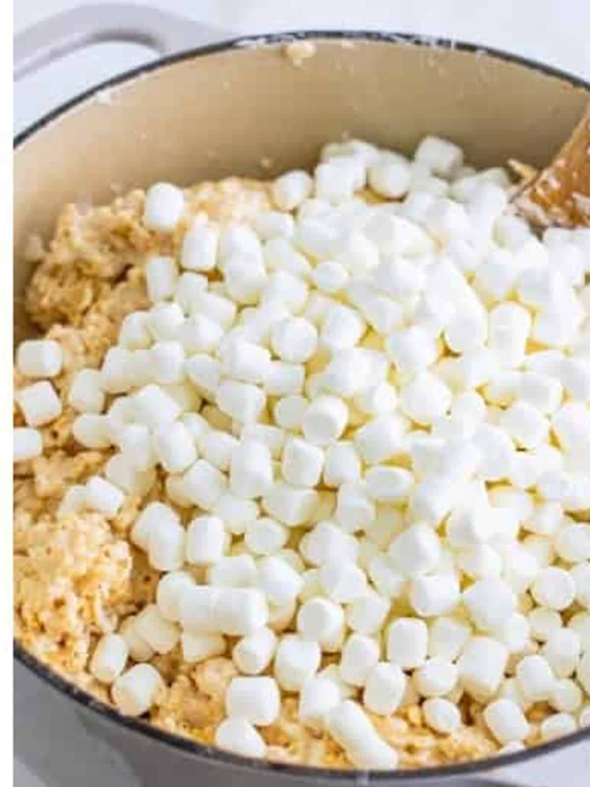 Reserved mini marshmallows added to the cereal mixture for extra gooey rice krispie treats.