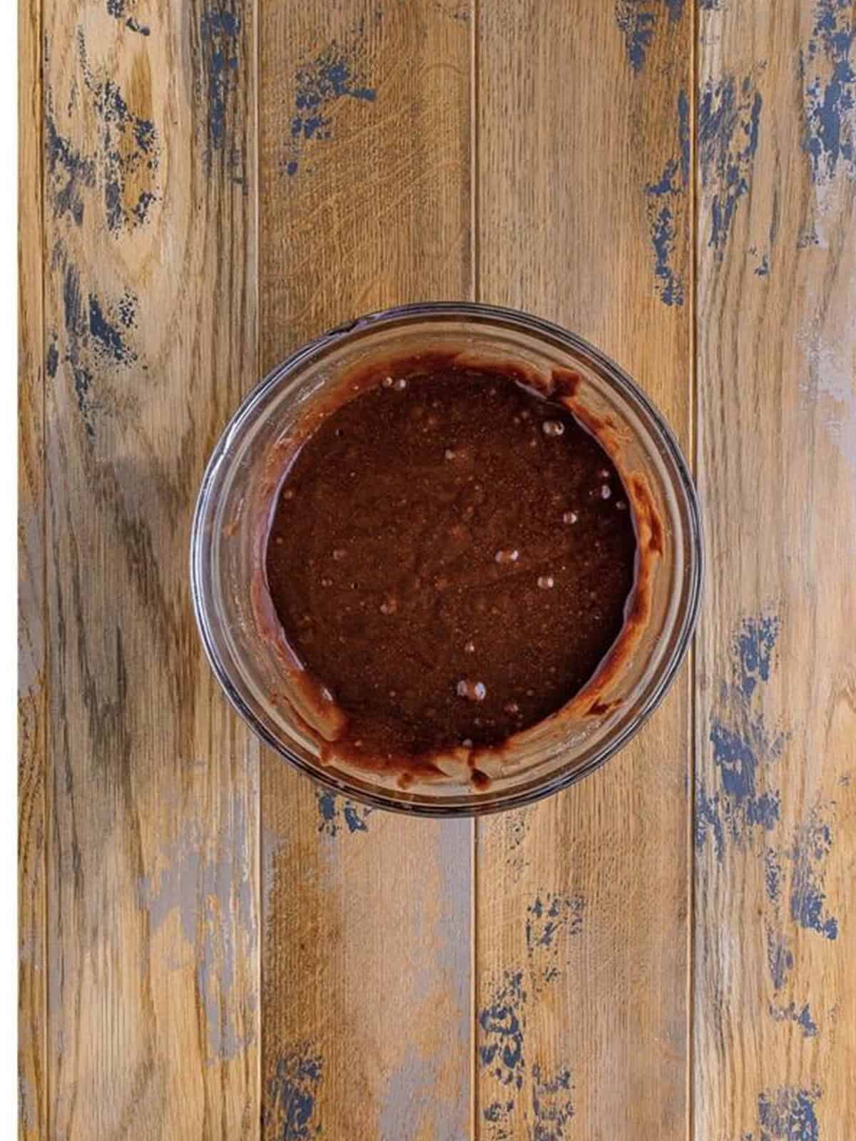 The brownie batter mixed smooth in the glass bowl.